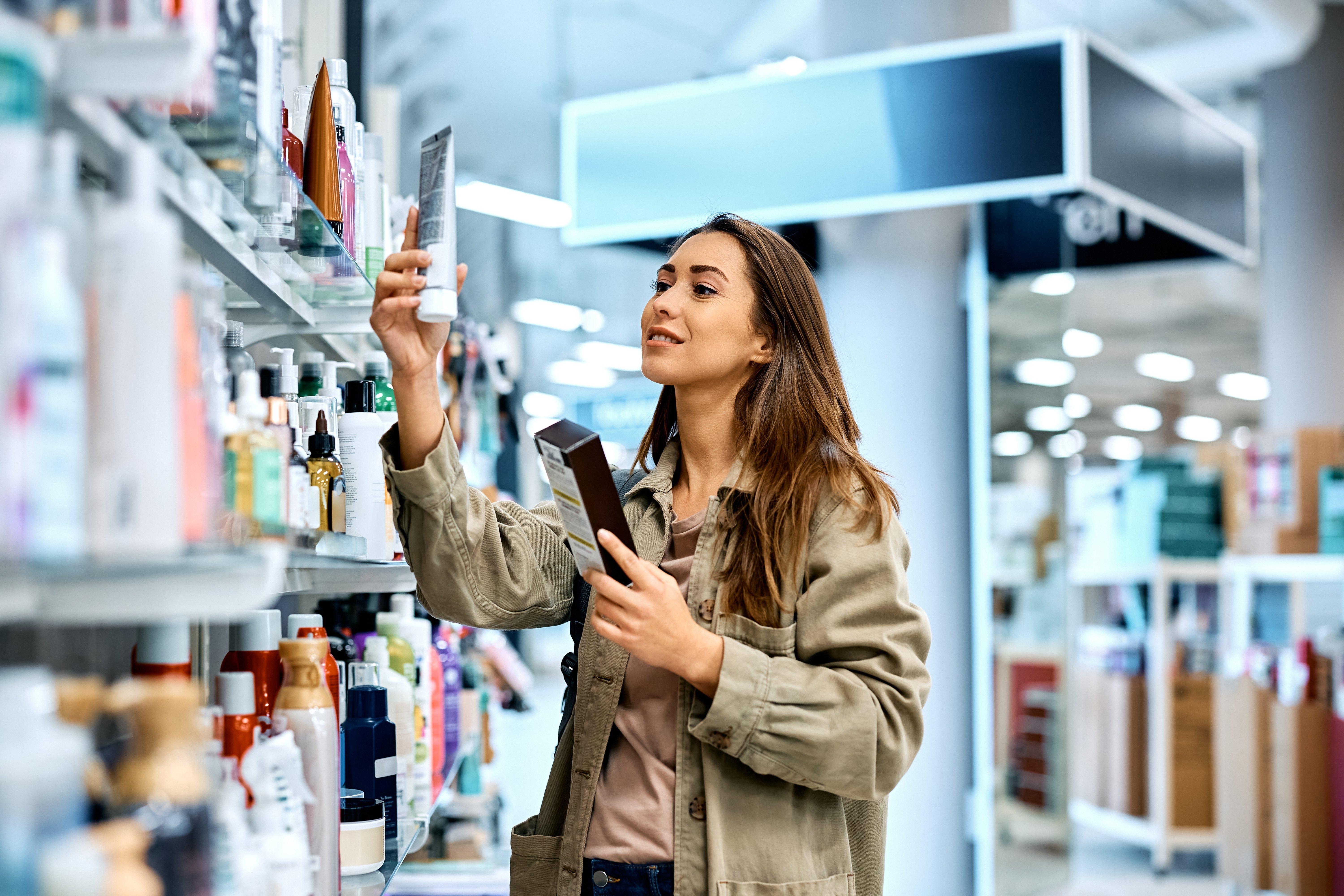 woman enjoying in buying beauty care